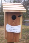 empty bluebird house with sign